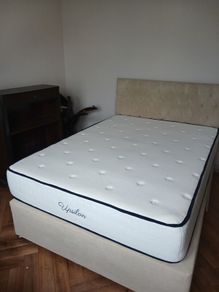 double bed with mattress and headboard
