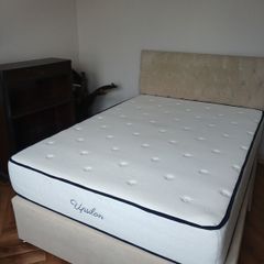 double bed with mattress and headboard