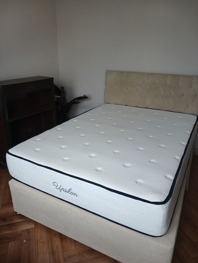 double bed with mattress and headboard