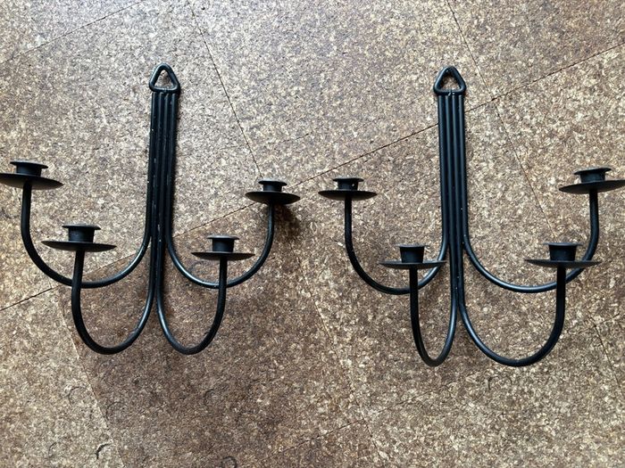 Pair of black metal wall sconces