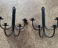 Pair of black metal wall sconces