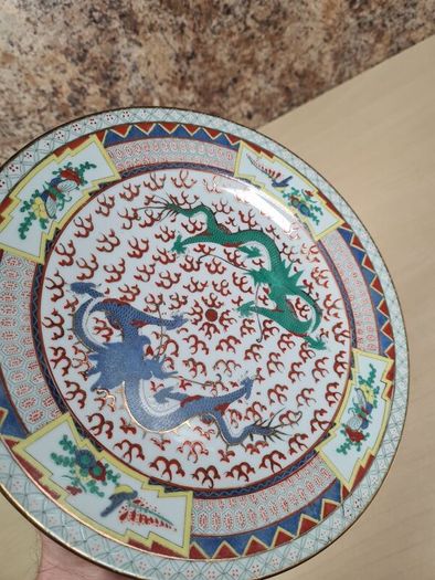 Vintage chinese porcelain plate with dragons decoration hand painted