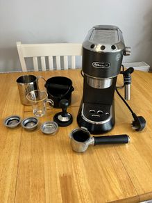 DeLonghi coffee maker plus accessories