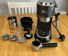 DeLonghi coffee maker plus accessories