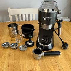 DeLonghi coffee maker plus accessories