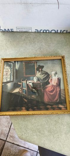 2 framed art work- 1- Vermeer's The Glass of Wine Fine Art Print -  Classic Wall Decor . 25.00euro.2- Helmsley Yorksire Colin Williamson Watercolour 35.00 euro.