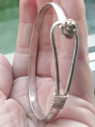 Vintage sterling silver bracelet with a rose-shaped clasp.