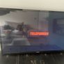 Telefunken 32" LED TV with secure wall mount and original remote Image 2