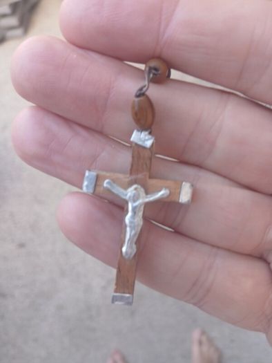 Title: Authentic Jerusalem Olive Wood Rosary & Leather Case  Description: Selling an authentic Catholic rosary made from Holy Land olive wood beads. The back of the crucifix is stamped "JERUSALEM", and the center medal is stamped "TERRA SANTA" with a 