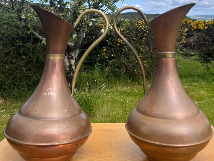 Pair of antique copper jugs