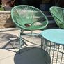 Marks & Spencer Lois garden furniture set in sage green, comprising two armchairs and a matching round table. Image 2
