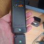 Sony Ericsson W200i , with charger and speakers. Image 5