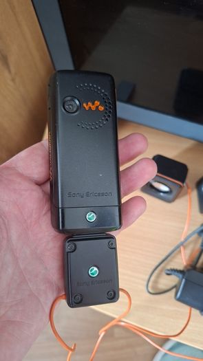 Sony Ericsson W200i , with charger and speakers.