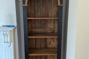 Tall black and wood colour bookcase