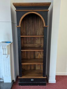 Tall black and wood colour bookcase