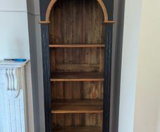 Tall black and wood colour bookcase