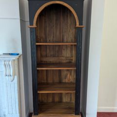 Tall black and wood colour bookcase