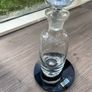Tall heavy clear glass spirit decanter with large solid glass stopper. Image 4