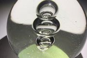 Clear glass three-bubble paperweight