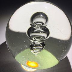 Clear glass three-bubble paperweight