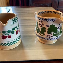 Nicholas Mosse two retired tiny jugs in perfect condition . A strawberry jug and a Geranium jug .   priced individually and will sell individually