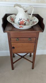 Antique washstand with ceramic jug and basin set