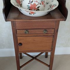 Antique washstand with ceramic jug and basin set