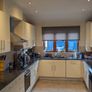 Kitchen with black granite worktop Image 4