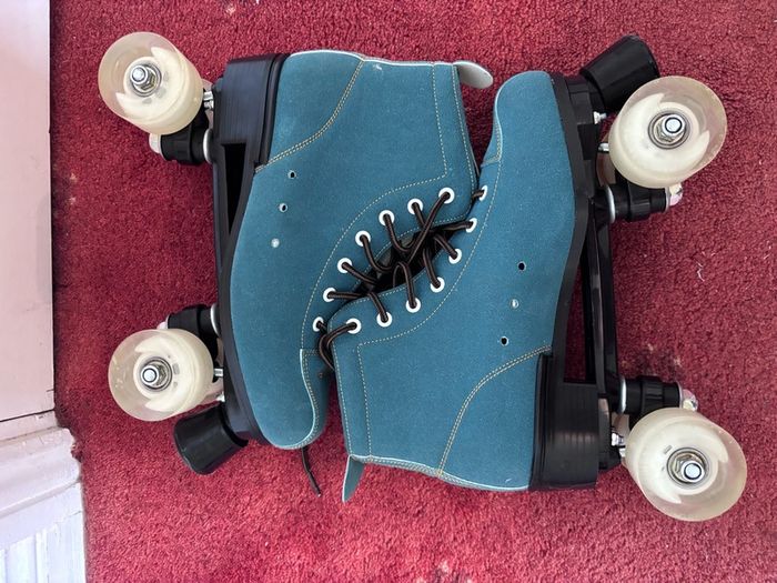 Teal suede roller skates