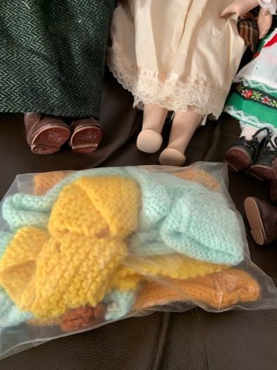 5 porcelain dolls with extra clothing perfect condition