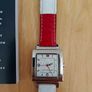 Tommy Hilfiger watch features a distinctive rectangular stainless steel case and a reversible red, white, and blue leather strap Image 3