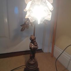 French Art Nouveau style vintage lamp featuring a spelter bronze figure