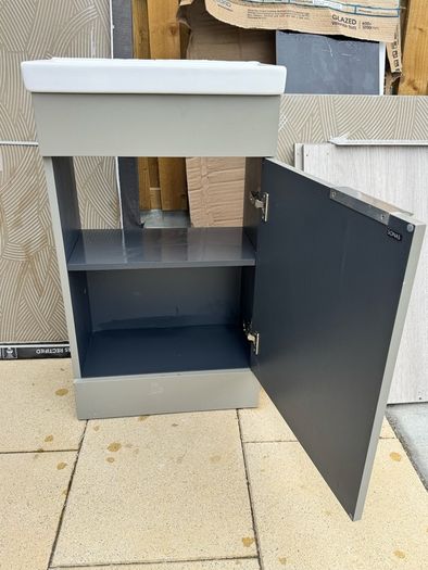Narrow Sink Along With Vanity Unit And Pipes; Kitchen Sink And Quartz Worktop Unit With Wooden Inparts