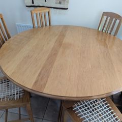 solid oak dining table and 6 chairs