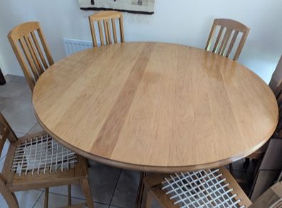 solid oak dining table and 6 chairs