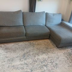 Grey L shaped corner sofa with 2 pouffes. Electric recline on long end