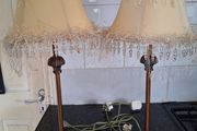 Lovely pair of tall.metal table lamps with cream shades