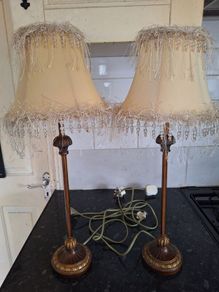 Lovely pair of tall.metal table lamps with cream shades