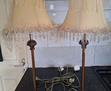 Lovely pair of tall.metal table lamps with cream shades