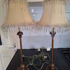 Lovely pair of tall.metal table lamps with cream shades