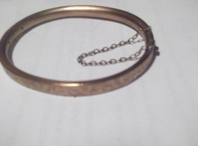a vintage gold plated  bangle. bracelet