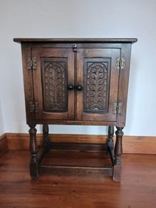Small curved oak cabinet