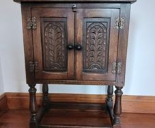 Small curved oak cabinet
