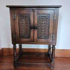 Small curved oak cabinet