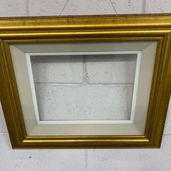 A very nice gold frame and glazed