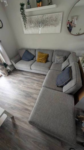 Gray fabric corner chase sofa with footstool