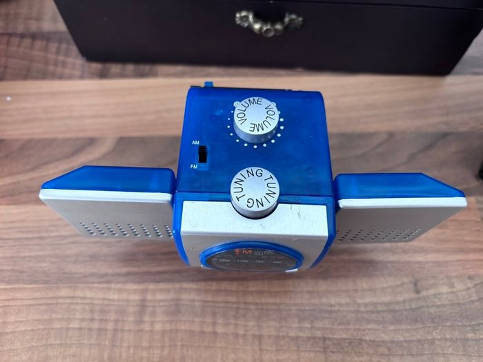 Portable FM-AM radio with blue transparent casing