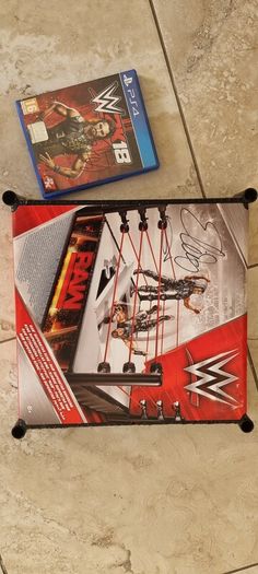 Signed WWE RAW ring and WWE2K18 PS4 game