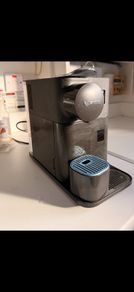 Nescafe Delonghi Coffee Machine with milk frother attached