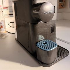 Nescafe Delonghi Coffee Machine with milk frother attached